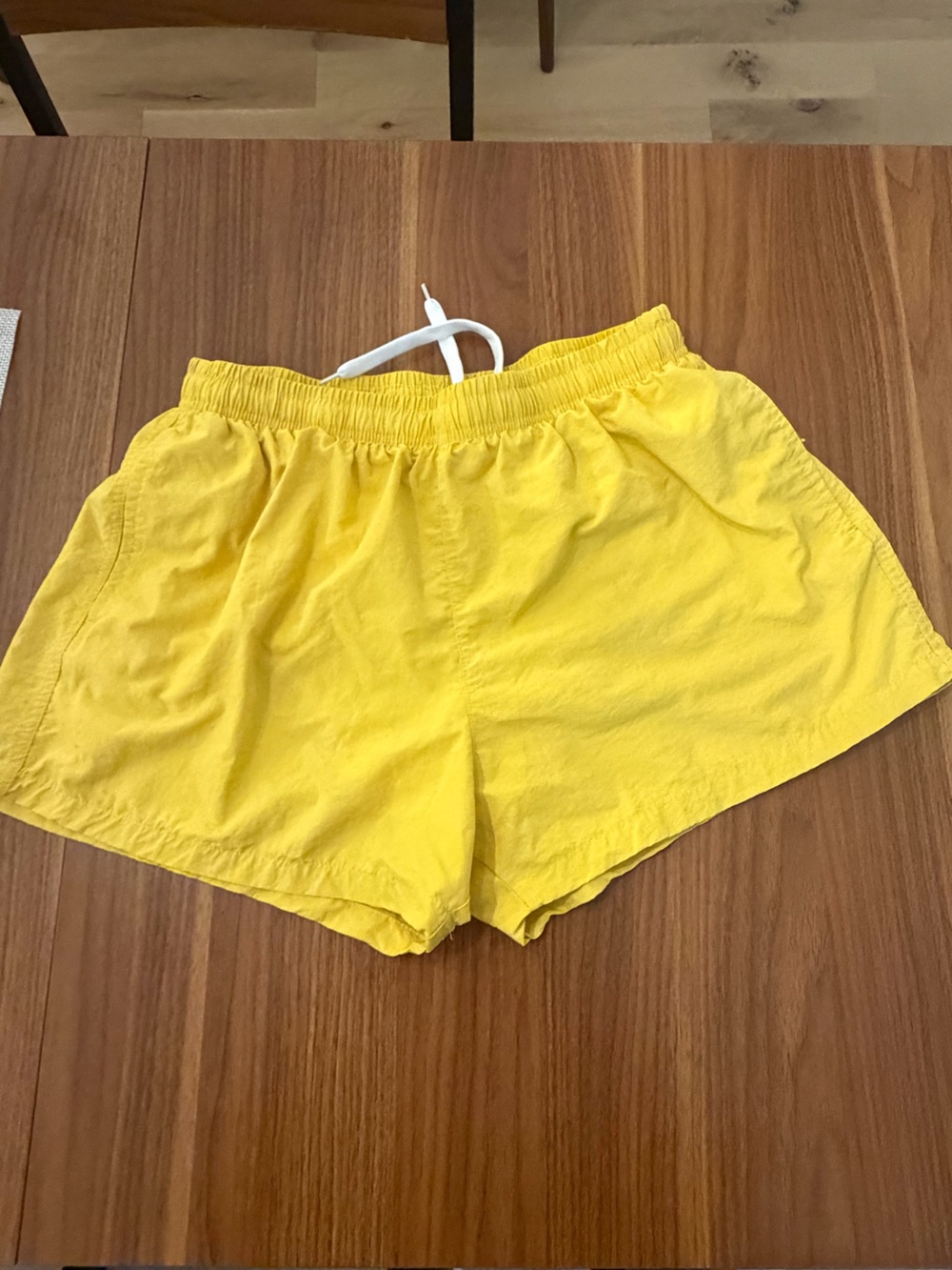 Men’s Yellow swim shorts, small